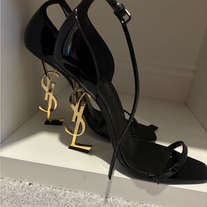 Yves Saint Laurent Black Heels with Gold Logo Accent